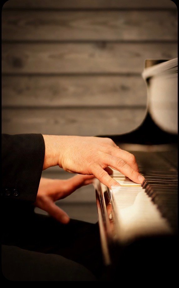 Hands on piano keys, playing gospel music